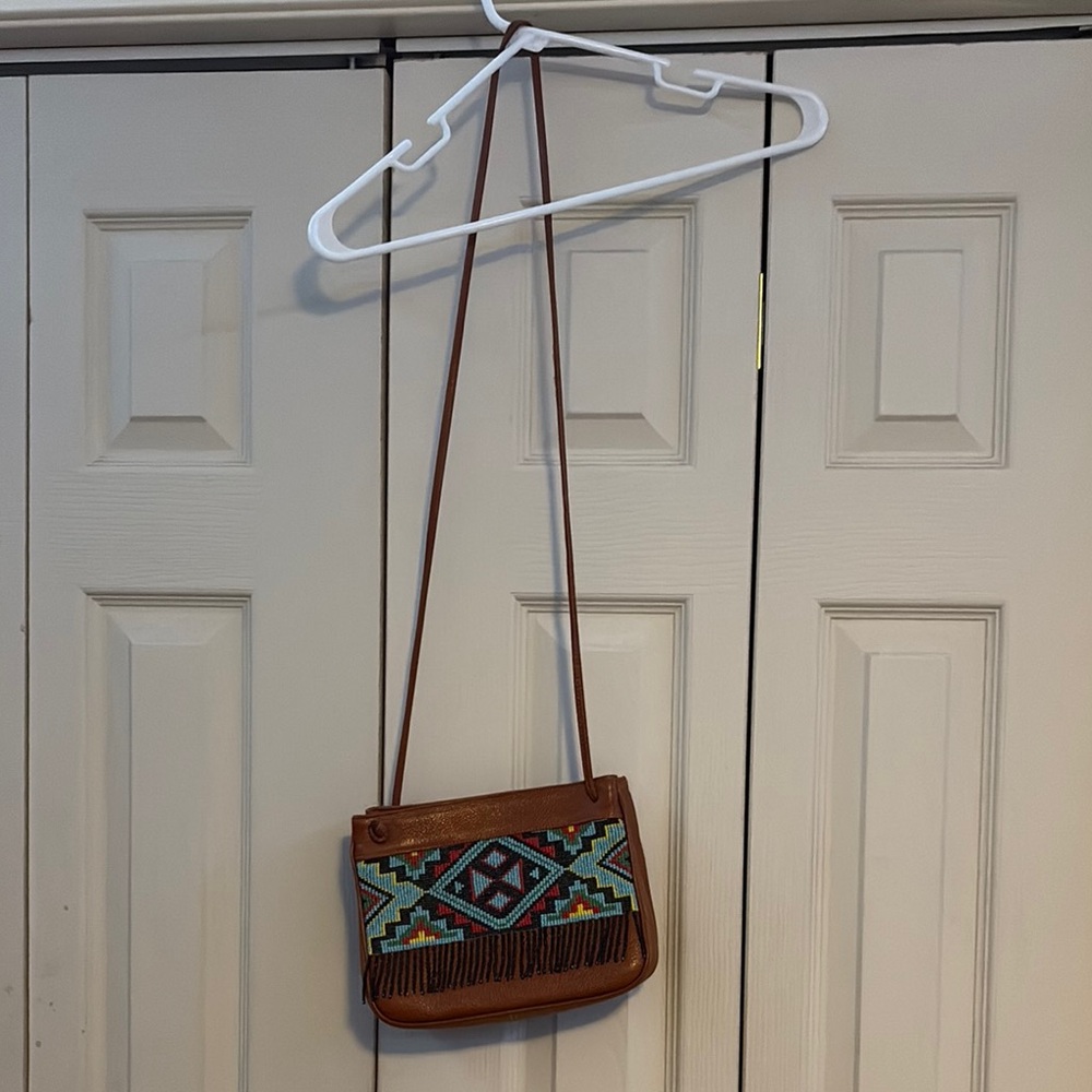 Brown Crossbody Bag with Adjustable Strap and Patterned Design